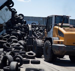 ELT (End-of-Life Tires) are picked up by a dozer